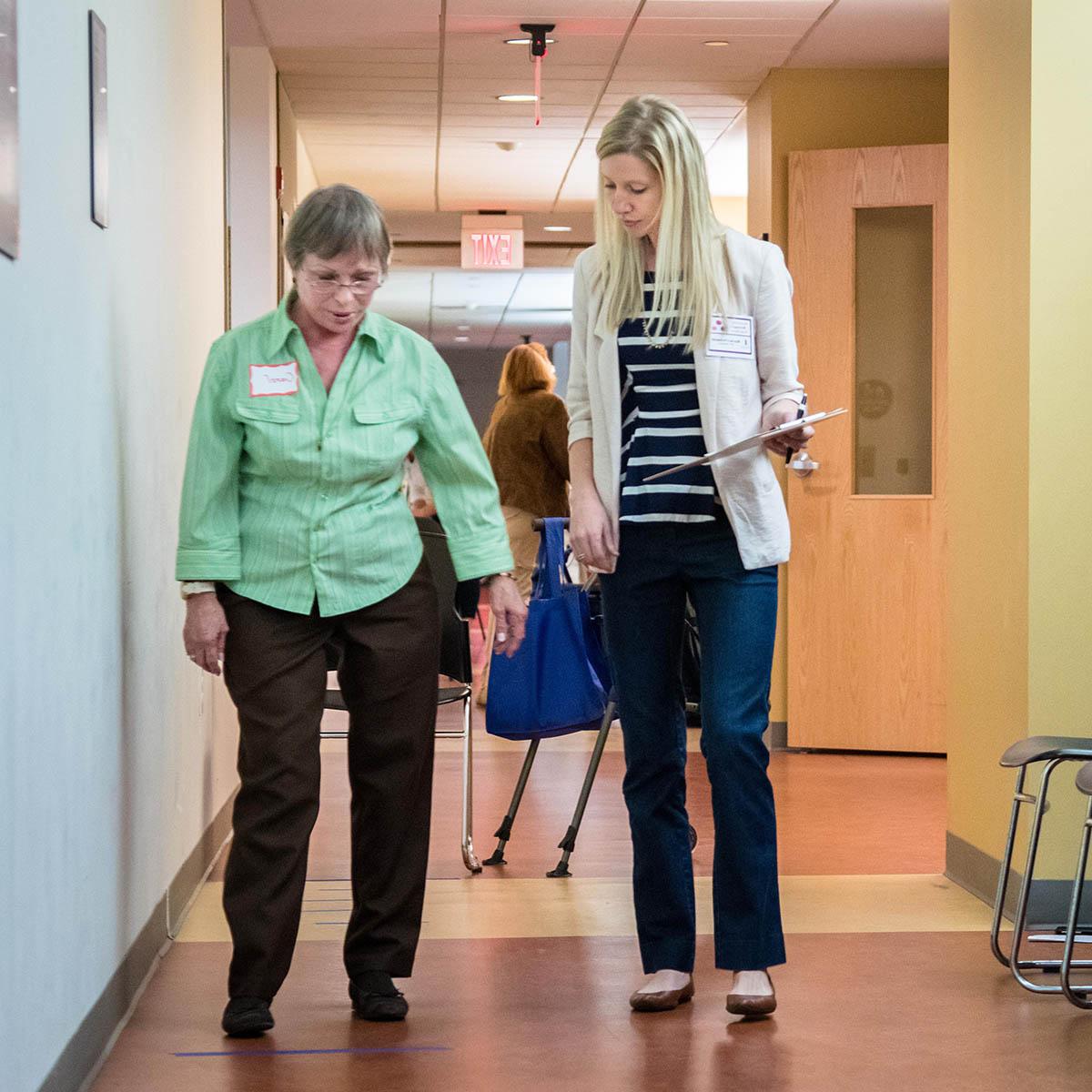 Photo of a physical therapy student working with a woman amputee